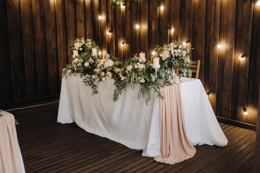 wedding table decoration with flowers on the table in the castle, table decor for dinner by candlelight.Dinner with candles photo