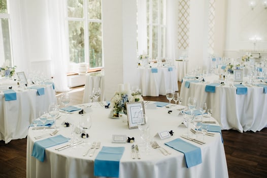 wedding table decoration with blue flowers on the table in the restaurant table decor for dinner at the wedding. photo