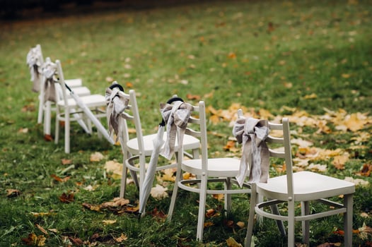 Autumn wedding ceremony on the street on the green lawn.Decor with arches of fresh flowers for the ceremony photo