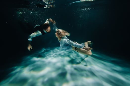 A woman and a man meet under water.A couple of lovers under water photo