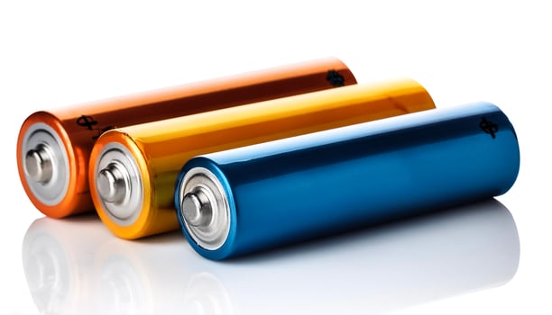 Three batteries, isolated on white background photo