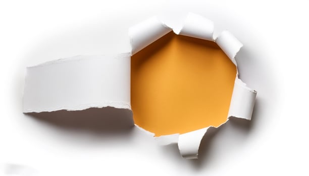 a white paper hole torn photo