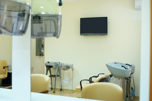 Chair for washing hair in a Barber shop. Interior of a Barber shop. A cruel place. Chair in beige leather in a beauty salon. photo