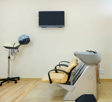 Chair for washing hair in a Barber shop. Interior of a Barber shop. A cruel place. Chair in beige leather in a beauty salon. photo
