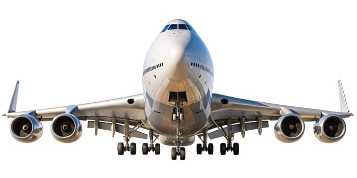 Large jumbo airplane with four engines isolated on white background photo