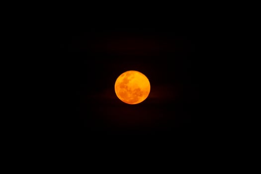 Oange full moon in the dark background. photo