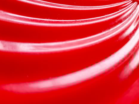 Glossy abstract background with red color. defocused and close up of red plastic tube texture for abstract background and design. photo
