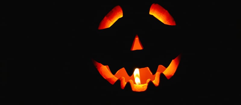 Jack-o'-lantern Face with Glowing Candle photo