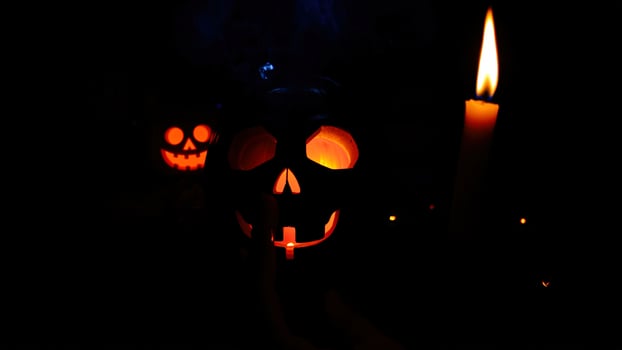 Spooky Halloween Jack-o'-lantern with Candlelight photo