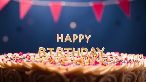 Close-up of a Birthday Cake with Happy Birthday in Gold photo