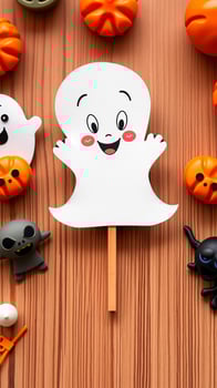 Happy Ghost Halloween Decoration on Wooden Background photo