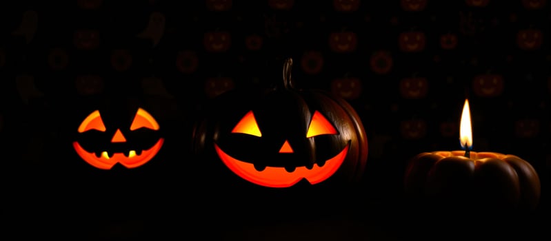 Glowing Jack-o'-Lanterns and a Candle in the Dark photo