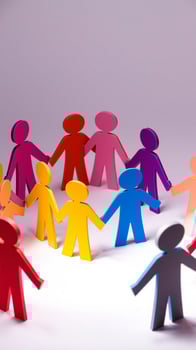Colorful Paper Cutout People Holding Hands in a Circle photo