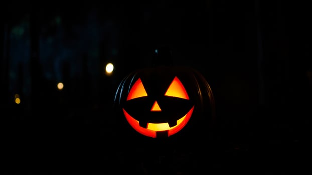 Illuminated Jack-O-Lantern In The Darkness photo