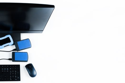 Multiple external hard drives connected to a monoblock on a white background.Computer with hard drive photo