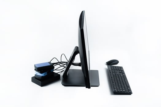 Multiple external hard drives connected to a monoblock on a white background.Computer with hard drive photo