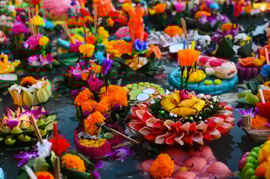 Many Krathongs for Loy Krathong Festival in Thailand floating on dirty river that cause by people throw krathong on river. photo