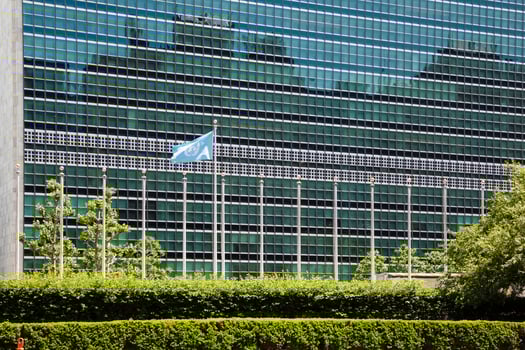 A large building with a large flag on it photo