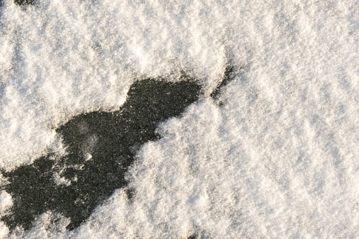snow background. Snow lying on the ice. Snow texture photo
