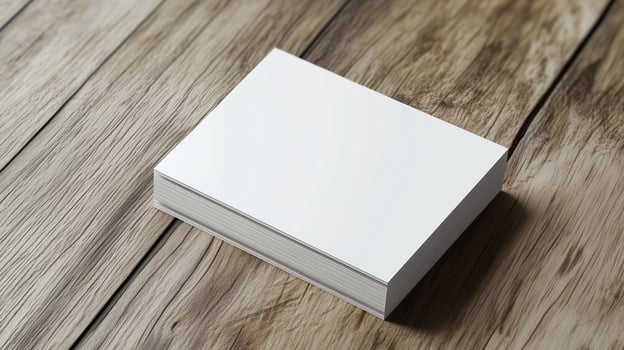 Blank business cards on a rustic wooden surface ready for customization and branding in a creative workspace photo