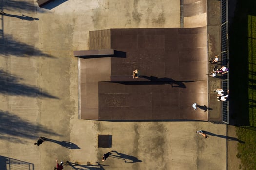 Children ride on the outdoor skateboard court.Skatepark for sports photo