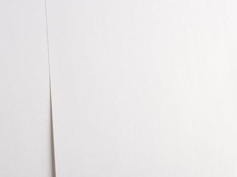 White paper with smooth lines and layered overlays, creating a tranquil and peaceful texture. The photo