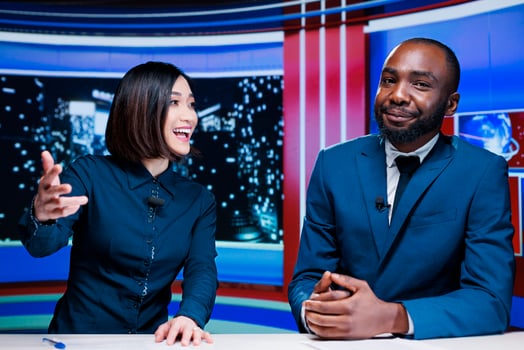 TV show hosts presenting breaking news live on television network, working together to create exclusive content for tv channel worldwide. Diverse journalists debate latest events. photo