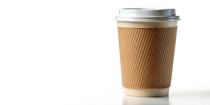 Macro view of a tall coffee take away cup on white background photo