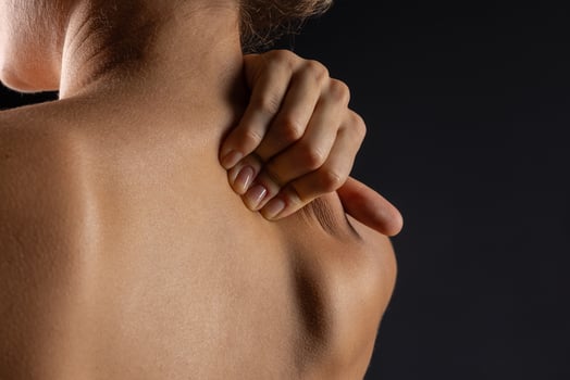 woman massaging neck close up, concept of neck pain with osteochondrosis protrusion and hernia photo