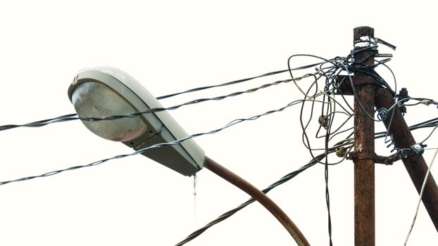 street lighting lamps and cables on a sky background photo