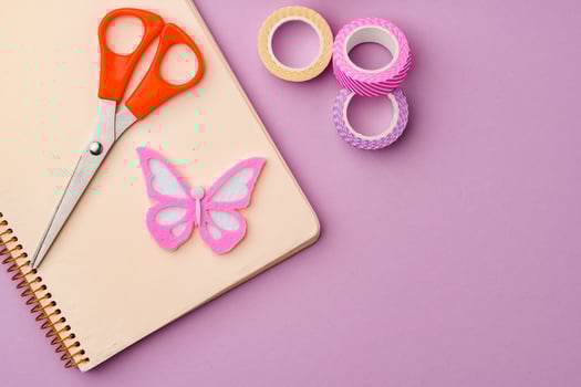Crafting supplies on a purple background ready for creative projects photo