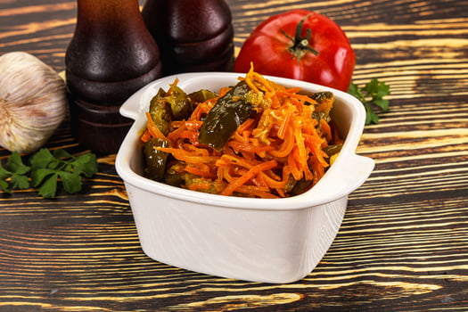 Salad with korean carrot and cucumber photo