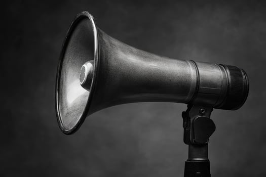 Black Vintage Megaphone on a Gray Background photo