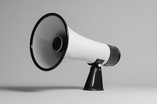 White and Black Megaphone on a Gray Background photo