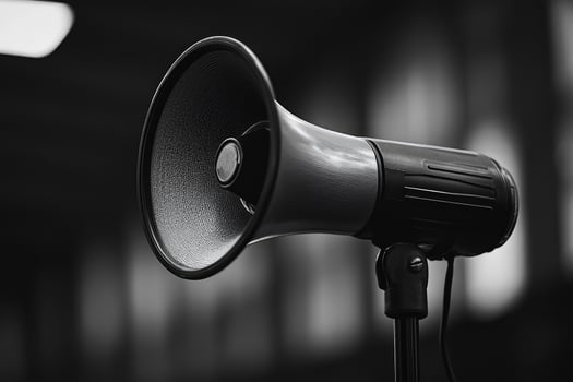A Black and White Close-Up of a Loudspeaker on a Stand photo