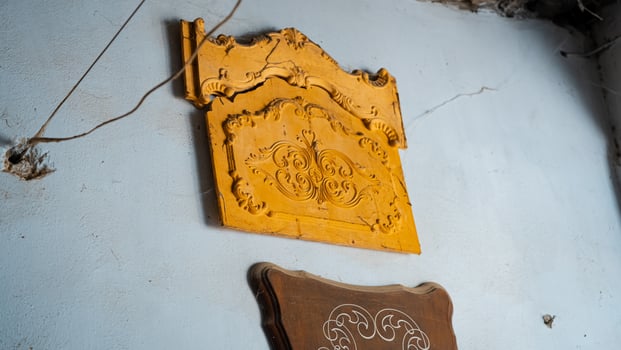 carving element. furniture in classic style. white color wood with gold trim. patina. carving. small depth of field. luxury furniture. use as background. High quality photo