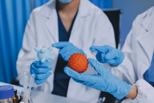 Scientist using microscope in laboratory. Close-up of a researcher's hands adjusting a modern microscope in a lab setting. Science concept photo