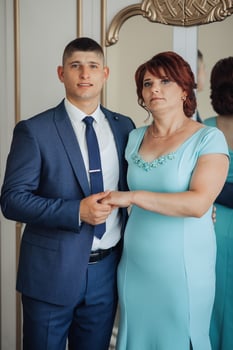 A man and woman are posing for a picture photo
