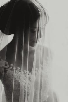 A woman is wearing a veil that is covering her face photo