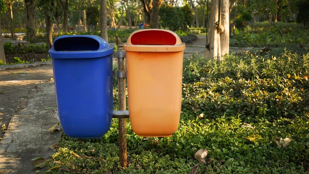 trash cans used to accommodate organic and non-organic waste from city parks photo