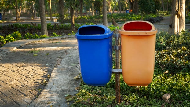 trash cans used to accommodate organic and non-organic waste from city parks photo
