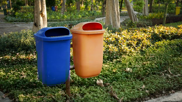 trash cans used to accommodate organic and non-organic waste from city parks photo