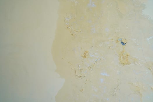 Water seeps into the walls of leaking pipes, causing water stains and peeling paint photo