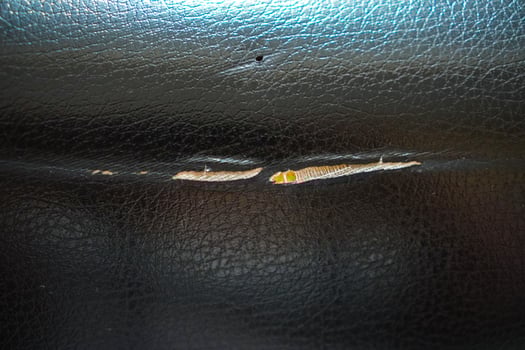 The texture of the black motorbike seat is torn photo