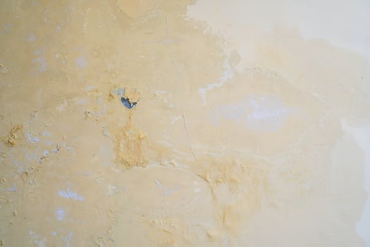 Water seeps into the walls of leaking pipes, causing water stains and peeling paint photo
