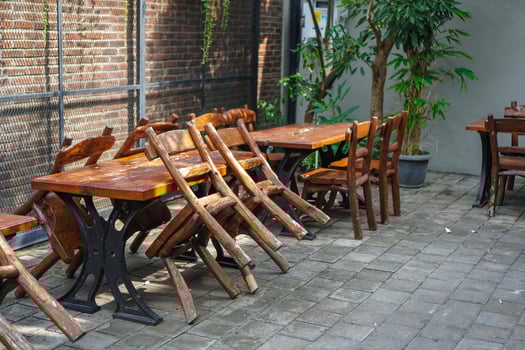 simple minimalist wooden tables and chairs for sitting and drinking coffee in a coffee shop with a natural atmosphere photo