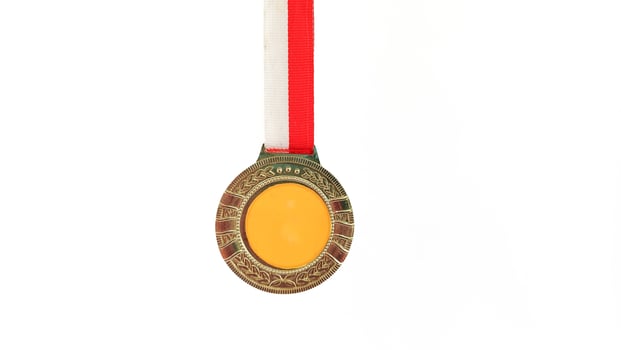 The winner's gold medal is held in the athlete's raised hand on a white background photo