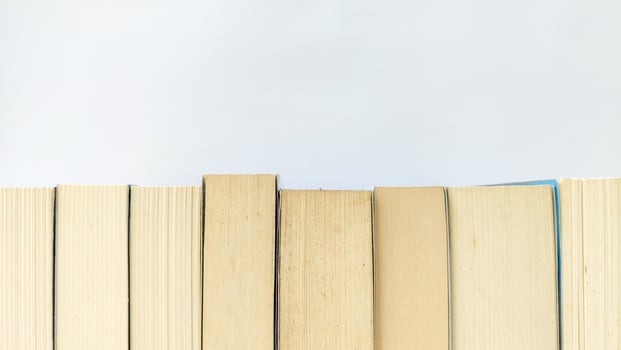 stack of colorful books on white background, open book, stack of books isolated on background, education, read, study, school, library, dictionary. photo