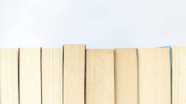 stack of colorful books on white background, open book, stack of books isolated on background, education, read, study, school, library, dictionary. photo
