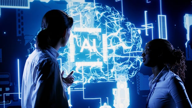 African american engineer and asian coworker looking at hologram of artificial intelligence human brain simulation. BIPOC IT team members interacting with AR AI visualization photo